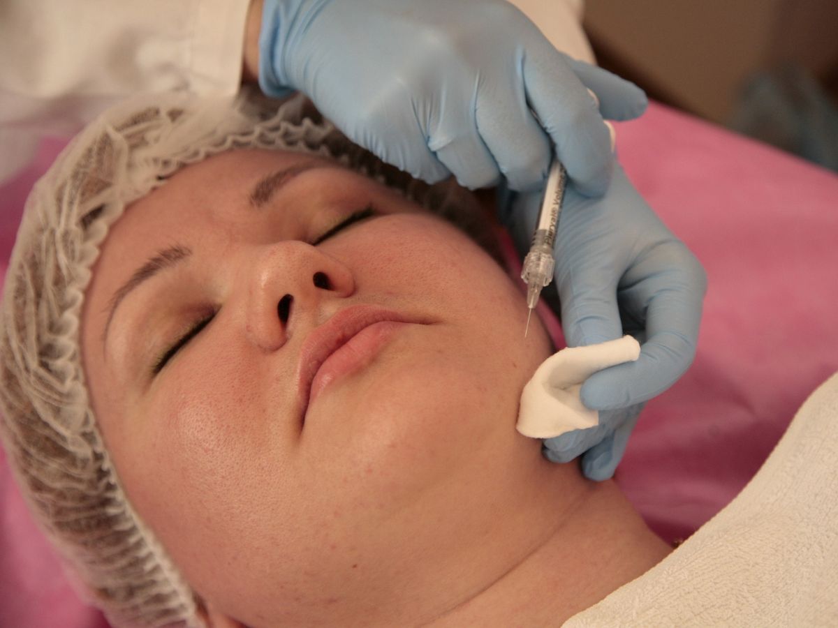 Upclose of a woman receiving botox from a dermatologist